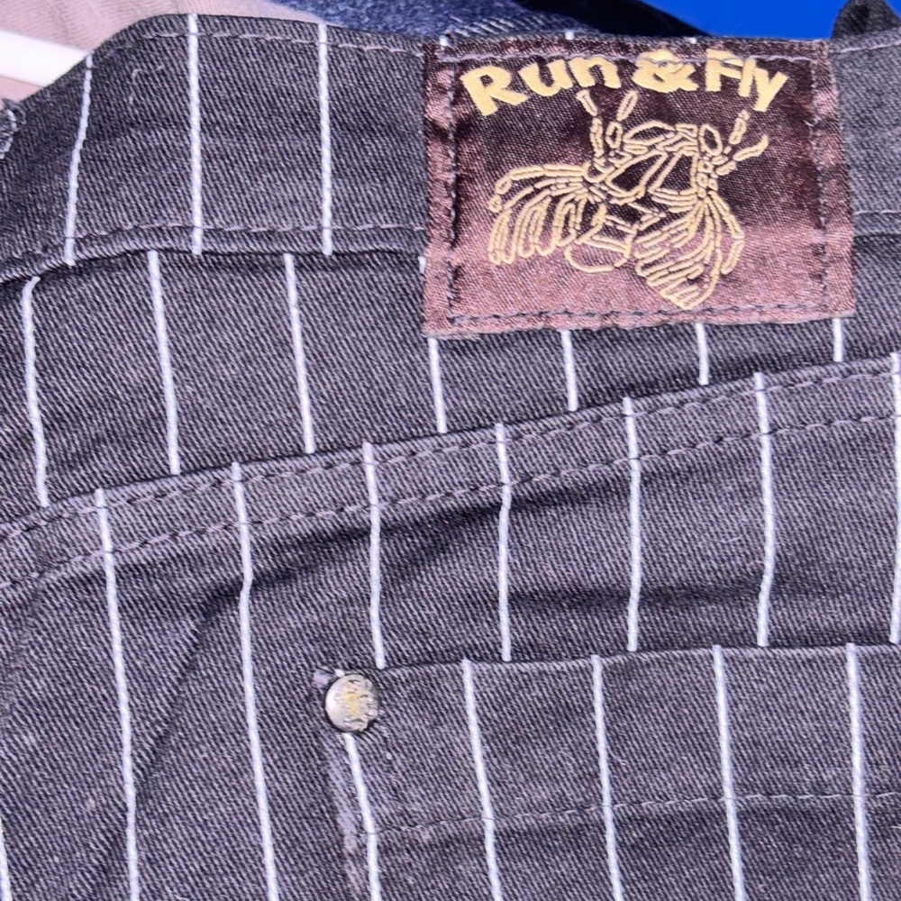 Run and Fly.  Low rider stretch pinstripe unisex skinny jeans.